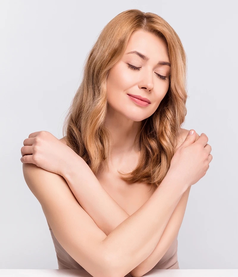 Woman hugging herself